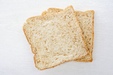 Whole wheat bread on white background