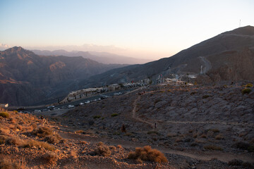 Jebel Jais, the UAE's tallest peak, offers breathtaking views, thrilling ziplines, and cool weather. A serene retreat for adventurers and nature lovers with stunning sunsets.