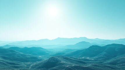 Obraz premium Serene mountain range vista, summer sunlight, hazy sky, peaceful landscape; ideal for travel brochures.