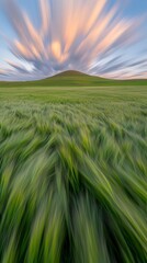 Sunrise Over Rolling Fields with Vibrant Clouds