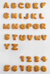 set of Bakery alphabet. Alphabet for Christmas decor or seasonal quotes. cookie font alphabet 0,1,2,3,4,5,6,7,8,9,10,11 isolated on white background. crackers in the form of the abc letters, digits