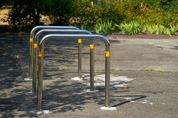 Bicycle parking racks on the asphalt area in the school yard
