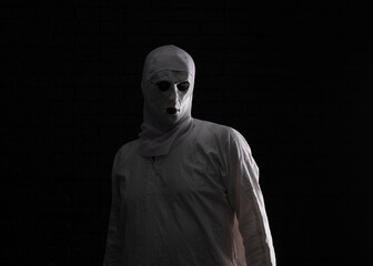 man in scary nun mask