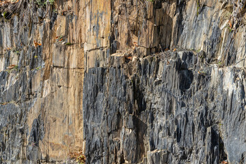 Teberdinsky National Park. Dombay, Karachay-Cherkessia. Seep cliffs are solid rocks with multi-colored vertical texture. Nature concept for design.