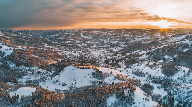 Winter sunset over a snow-covered valley in the mountains