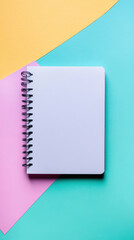 A notebook mockup with a spiral binding, placed on a vibrant, colorful background, perfect for showcasing custom designs, branding, or artwork in a dynamic and eye-catching presentation.
