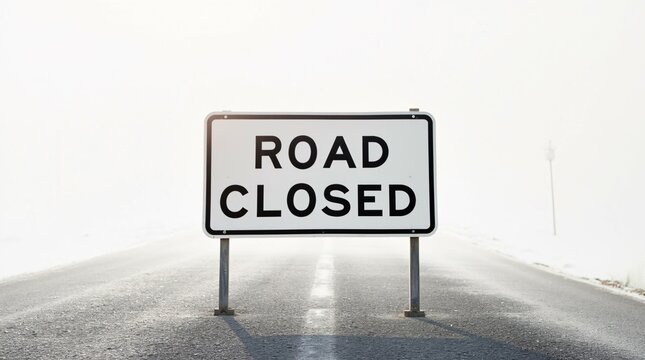 Road Closed Sign on Foggy Road With White Background.
