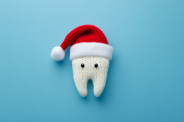 Cute Tooth Character Wearing Santa Hat on Blue Background