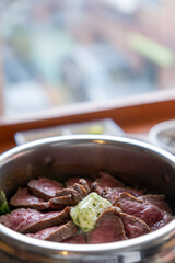 Rare beef rice in a steamed pot with butter. Korean food