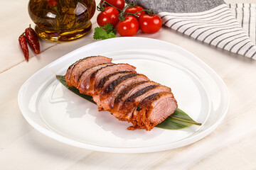 Sliced duck breast baked with cherry