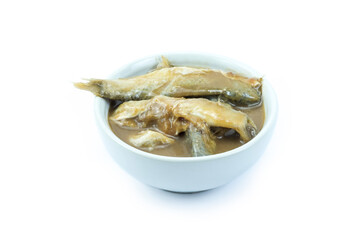 Close up and stack a cup of pickled fish isolated on white background. Preserves fish by keeping it in brine and roasted rice over a period without refrigeration, ingredient for cooking