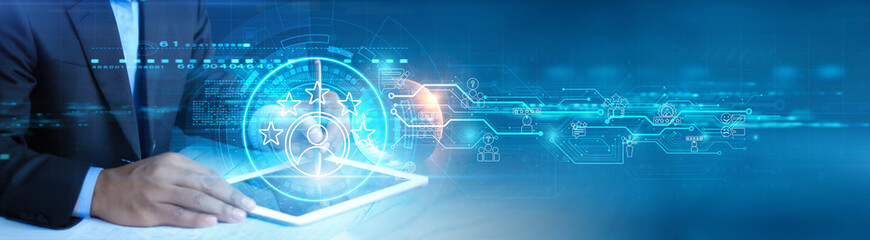 Businessman holding and using a digital tablet device with customer satisfaction insights, data-driven decision-making, improved service quality, enhanced customer experience, and loyalty-building.