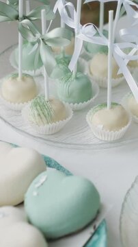 delicious white and blue cakes and sweet desserts macaroons lie on the buffet. Banquet table at the event and holiday. Confectionery sweets close-up