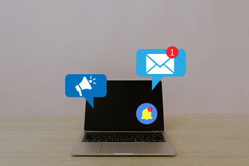 Digital marketing,Online communication,Notification,E-mail incoming concept.,Laptop interface featuring online notifications, email alerts, and a megaphone icon representing digital connectivity.