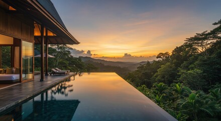 Fototapeta premium Luxury tropical villa, infinity pool, sunset view, lush jungle landscape, modern architecture, reflective water surface, golden hour light, expansive balcony, floor-to-ceiling windows, tranquil atmosp