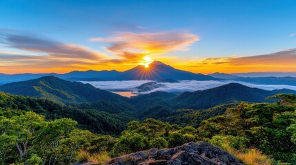 A photostock of a sunrise view of a misty valley with rolling hills, illuminated by warm golden light, symbolizing new beginnings and natural beauty. High Quality