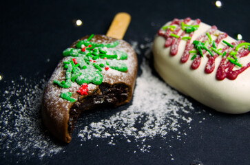 Tasty chocolate сake pops on black background.	