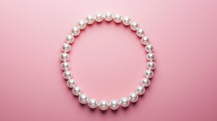 Obraz premium Pearl necklace arranged in a circle, soft pink backdrop