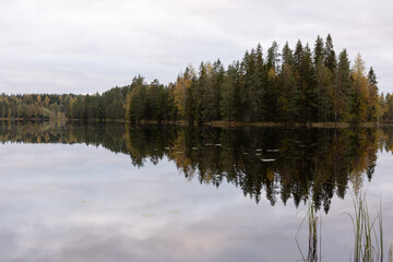 Fototapeta premium Cloudy evening by the lake at October in Finland