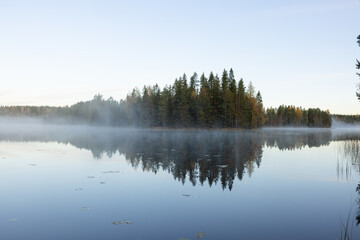 Foggy mornign by the lake in fall