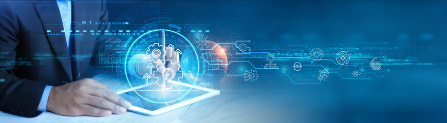 Businessman holding and using a digital tablet device with automation process management, intelligent workflow optimization, predictive analytics dashboard, real-time data visualization concept.