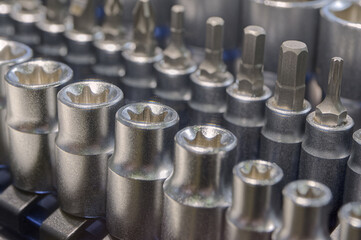 Set of torx, hex and phillips screwdriver heads and sockets of different sizes in a toolbox