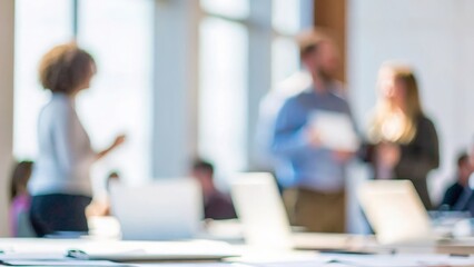 A blurred background of professionals collaborating during a workshop session.
