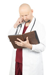 Pensive male doctor in a white coat examining information on a tablet in a leather case