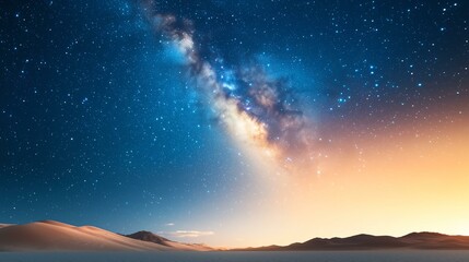 Fototapeta premium A stunning view of the milky way galaxy over a desert landscape at twilight.