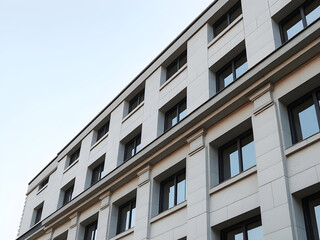 Fototapeta premium Modern Minimalist Building Exterior with White Facade and Windows