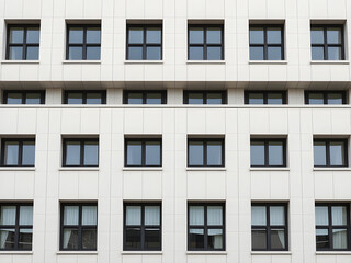Modern Minimalist Building Exterior with White Facade and Windows