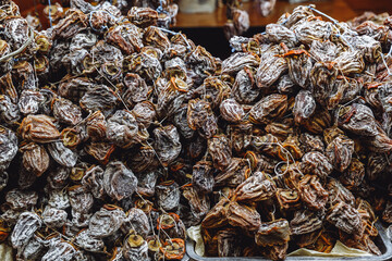 Dried persimmon fruits are sold at the market. dried fruits.