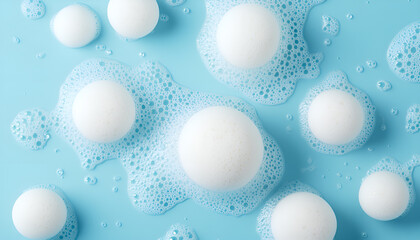 Face cleansing mousse sample. White cleanser foam bubbles on blue background, copy space. Soap, shower gel, shampoo foam texture closeup