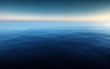 Obraz premium Calm ocean at sunset, serene blue water.