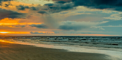 Colorful sunset on sandy beach of the Baltic Sea. No AI tools were used
