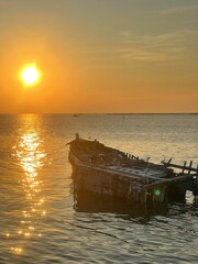 Fisherman village at Chonburi Province. Many fishing boats moored at wooden pier.