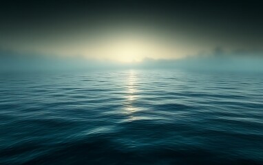 Obraz premium Misty sunrise over calm ocean.