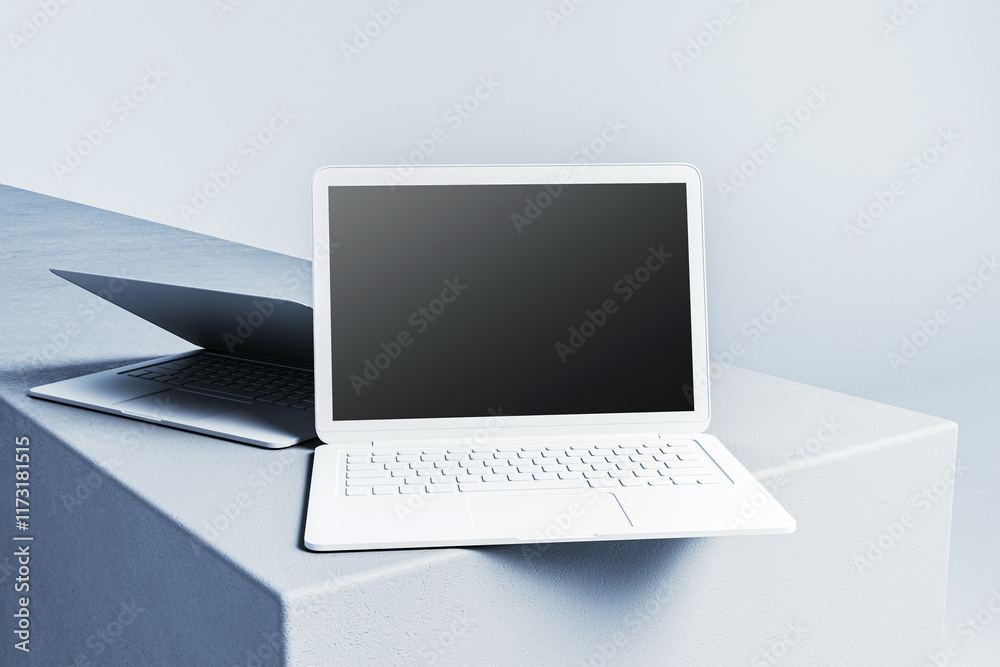 Poster Minimalist white and silver laptops on clean abstract platforms, showcasing sleek modern design with empty screens for creative projects. 3D Rendering