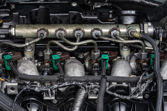 Close-up of fuel injectors and common rail in a diesel engine