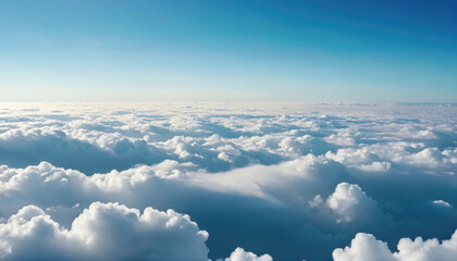 Fototapeta premium Sunny clouds stretch across a vast sky over an endless horizon at midday