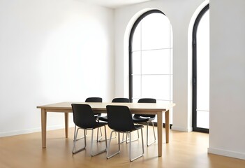 A modern dining room with a rectangular wooden table, four black chairs, and a large arched window in the background.