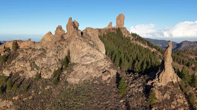 Exploring Roque Nublo in Gran Canaria, a stunning natural monument surrounded by lush terrain