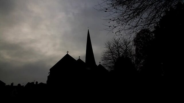 Creepy church with twisted spire in silhouette. St Mary&rsquo;s Church, Cleobury Mortimer, Shropshire, England, with twisted spire, UK, landscape