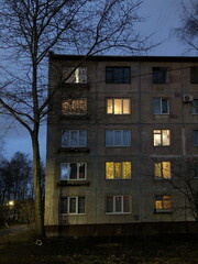 Light in the windows. Holiday illumination. Evening landscape