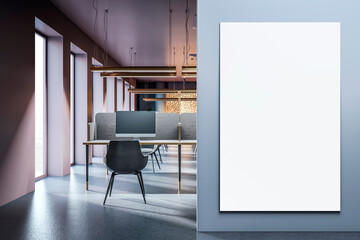 Modern office interior with a vertical blank canvas on the wall, showcasing a clean and...