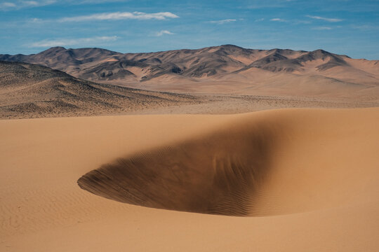 Large sand dunes in a remote desert landscape, Chile