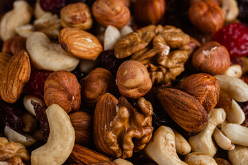 Mixture of nuts and dried fruits close-up.