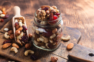 Mixture of nuts and dried fruits close-up.