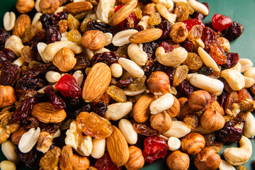 Mixture of nuts and dried fruits close-up.