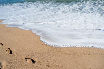 Foam from waves on the beach.